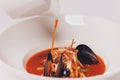 Delicious Mediterranean style tomato seafood soup with a variety of mixed seafood.