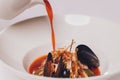 Delicious Mediterranean style tomato seafood soup with a variety of mixed seafood.