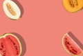 Delicious melons of different varieties and watermelon, halves and slices, on pink background with copy space for text Royalty Free Stock Photo