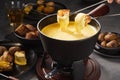 Delicious melted cheese fondue with dipping forks Royalty Free Stock Photo