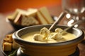 Delicious melted cheese fondue served in a traditional pot