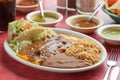 Delicious Mexican  taco with lettuce, rice and salsas  in a plate Royalty Free Stock Photo