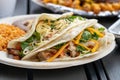 Delicious Mexican  tacos stuffed with sliced chicken parsley and carrots Royalty Free Stock Photo