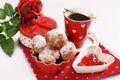 Delicious mini donuts and a cup of coffee for Valentine