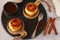 Delicious mini pastry cream tarts on rustic background