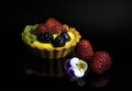 delicious mini tart with custard with raspberries and blueberries Royalty Free Stock Photo