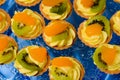 Delicious mini tart with kiwi and oranges