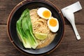 Delicious miso ramen noodles with egg in a bowl on a wood table.Top view Royalty Free Stock Photo