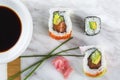 Delicious mixed sushi arranged on white marble surface Royalty Free Stock Photo