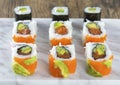 Delicious mixed sushi arranged on white marble surface Royalty Free Stock Photo