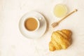 Delicious morning coffee cup with croissant close up on white Royalty Free Stock Photo