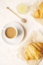 Delicious morning coffee cup with croissant close up on white Royalty Free Stock Photo