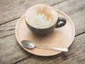 Delicious morning cups of latte coffee on the wooden table rustic background,Vintage Retro Filter