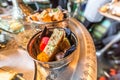 Delicious Moroccan sweets in a glass bowl on a copper tray