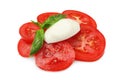 Delicious mozzarella ball, tomatoes and basil isolated on white. Cooking Caprese salad