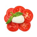 Delicious mozzarella ball, tomatoes and basil isolated on white, top view. Cooking Caprese salad