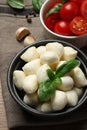 Delicious mozzarella balls, tomatoes and basil leaves on table, above view Royalty Free Stock Photo