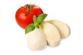 Delicious mozzarella cheese, tomato and basil leaves isolated on white. Cooking Caprese salad