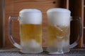 Delicious mug of super cold and refreshing draft beer on the table in the blurred background Royalty Free Stock Photo