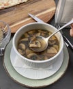 Delicious mushroom soup with dill and toast close-up on the table Royalty Free Stock Photo