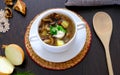 Delicious mushroom soup with parsley close-up on the table. Horizontal top view. Royalty Free Stock Photo