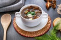 Delicious mushroom soup with parsley close-up on the table. Horizontal top view. Royalty Free Stock Photo