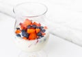 Delicious and natural glass with yogurt, oatmeal, strawberries, blueberries and milk all mixed ready to drink