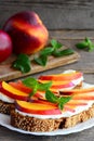 Delicious nectarine and cream cheese toast sandwiches. Homemade open sandwiches with cream cheese and fresh nectarine Royalty Free Stock Photo