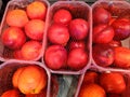 Delicious nectarines are in a cardboard tray on a supermarket shelf and are ready to be sold