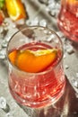 Delicious negroni cocktails with campari, gin, vermouth and slices of citrus orange and ice