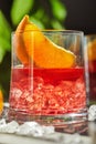 Delicious negroni cocktails with campari, gin, vermouth and slices of citrus orange and ice