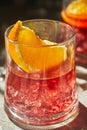 Delicious negroni cocktails with campari, gin, vermouth and slices of citrus orange and ice