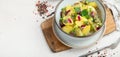 Delicious new potato salad with red onion, capers, greens in a bowl Royalty Free Stock Photo