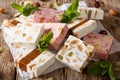 Delicious nougat with almonds and pumpkin seeds close-up. horizontal Royalty Free Stock Photo