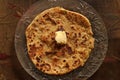 Delicious and nutritious Alu Paratha with pasteurized butter Royalty Free Stock Photo