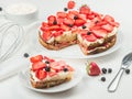 Delicious nutritious cake with fresh strawberries decorated with