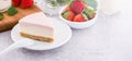 Delicious and nutritious handmade strawberry no bake frozen gradient colour fromage frais cheesecake slice with raw sarcocarp