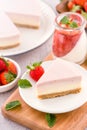 Delicious and nutritious handmade strawberry no bake frozen gradient colour fromage frais cheesecake slice with raw sarcocarp