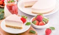 Delicious and nutritious handmade strawberry no bake frozen gradient colour fromage frais cheesecake slice with raw sarcocarp Royalty Free Stock Photo