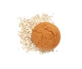 Delicious oatmeal cookie and flakes on white background