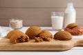 Delicious oatmeal cookies on white wooden table