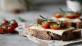 Delicious open-faced sandwich with cheese, tomatoes, and herbs served on rustic bread in a cozy kitchen setting Generative AI Royalty Free Stock Photo