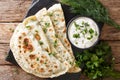 Delicious organic flat bread qutab stuffed with herbs served wit