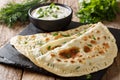 Delicious organic flat bread qutab stuffed with herbs served wit