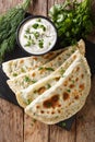 Delicious organic flat bread qutab stuffed with herbs served wit