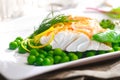 Delicious oven baked fish fillet with peas