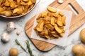 Delicious oven baked potatoes on marble table