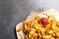 Delicious oven baked potatoes with sauce served on table, top view