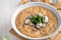 Delicious oyster vermicelli in a bowl on wooden table background