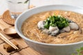 Delicious oyster vermicelli in a bowl on wooden table background
